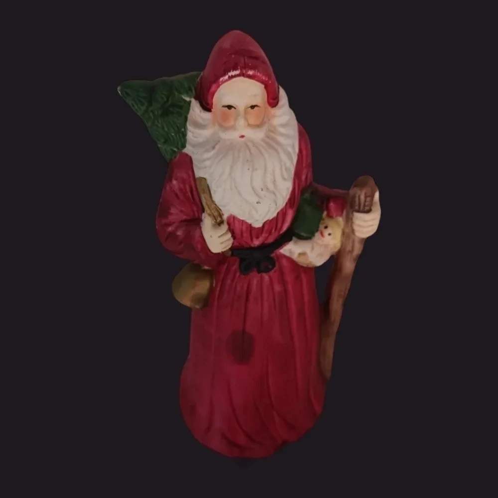 Santa fugurine with bell and christmas tree christmas decor
